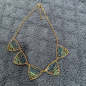 Gold necklace with blue beaded detail